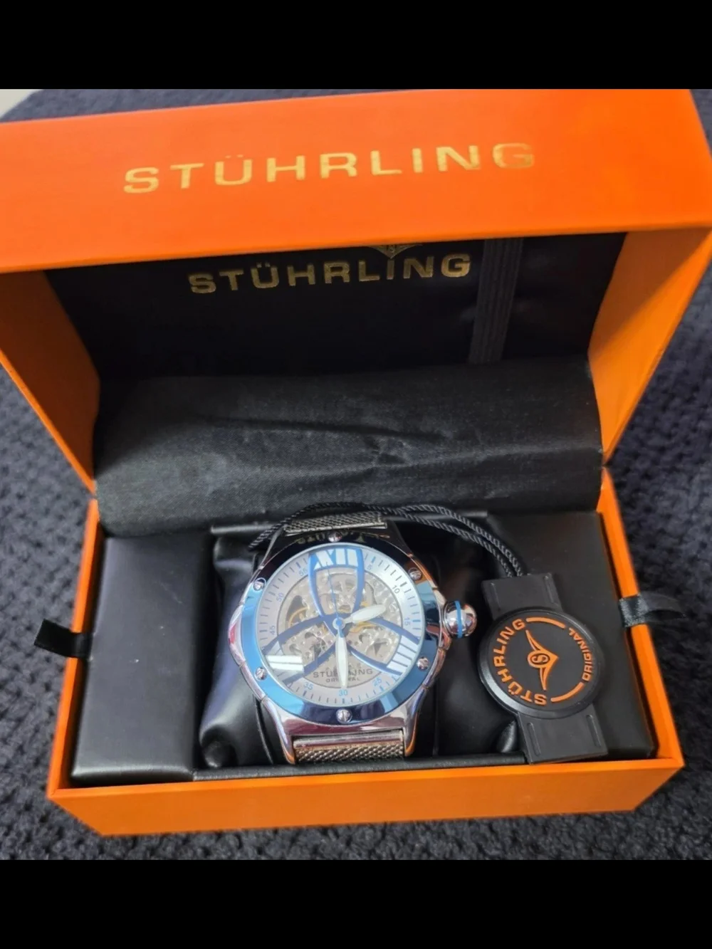 Stuhrling Silver Skeleton Dial Watch - Blue Accents